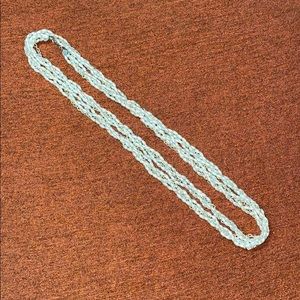 Beaded faux pearl and gold necklace.